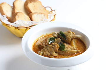 peranakan nonya spicy curry chicken cutlet and potato in white bowl with french toast bread in basket asian halal menu