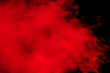 Red particles explosion on black background.Freeze motion of red dust splash.