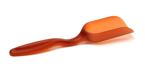 Wooden scoop over dry green tea leaves