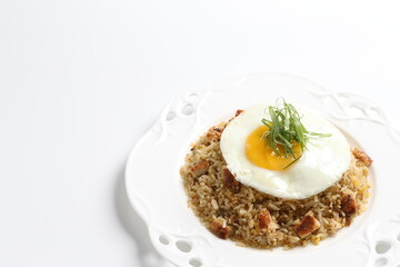 Japanese unagi fish wok garlic fried rice with fried egg and vegetables on white plate asian halal seafood menu