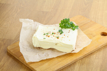 Greek Feta cheese over board