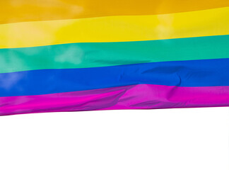 Rainbow flag in sunshine on white isolated