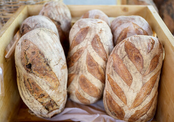 Loaves of fresh baked bread at a farmers market.