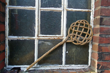 Closeup shot of an old carpet beater
