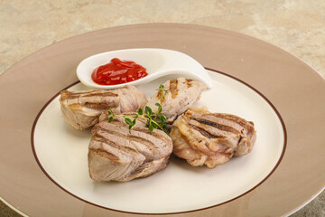 Grilled pork tenderlion with tomato sauce