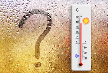 Rainy day. Question mark symbol written on glass. Thermometer for measuring air temperature shows...