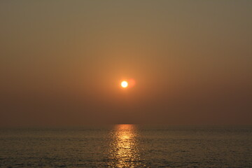 sunset over the sea kuakata