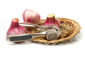 Garlic press and garlic on white background 