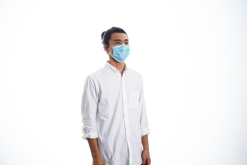 health, pandemic and safety concept - asian young man wearing face protective medical mask for protection from virus disease over white background