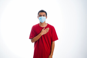 health, pandemic and safety concept - asian young man wearing face protective medical mask for protection from virus disease over white background
