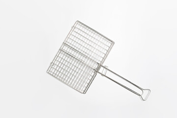 Stainless barbecue grill camping basket isolated on white background. High-resolution photo.