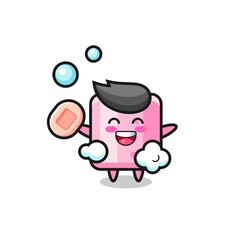 marshmallow character is bathing while holding soap