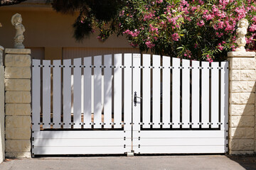 portal white plastic pvc house gate in street view