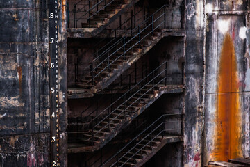 Fototapeta premium Part of a dry dock wall with a concrete staircase.