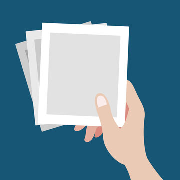 A beautiful hand grabbing three of blank polaroid pictures template flat vector illustration. Set of pictures in one hand reminds lots of memories isolated background.