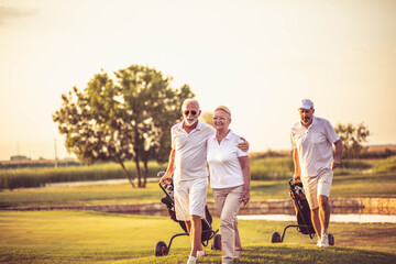 Three senior golfers. Focus is on man and woman. - 441704745