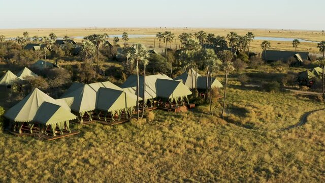 Aerial zoom out view of the beautiful tented safari lodge Jack's Camp on the Makgadikgadi Pans, Botswana