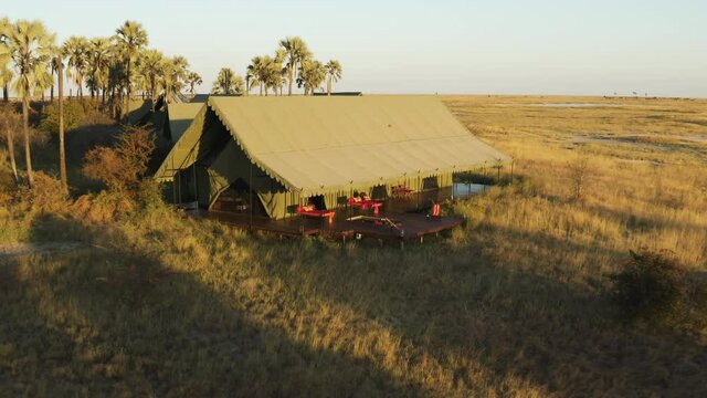 Aerial zoom out view of a private tent with swimming pool,safari lodge Jack's Camp on the Makgadikgadi Pans, Botswana