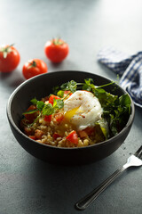 Bulgur with tomato and poached egg