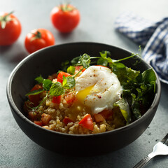 Bulgur with tomato and poached egg