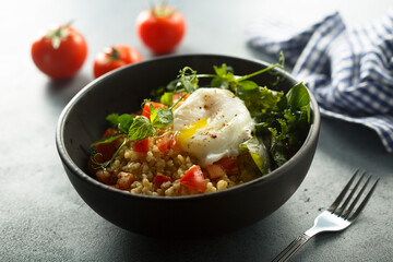 Bulgur with tomato and poached egg