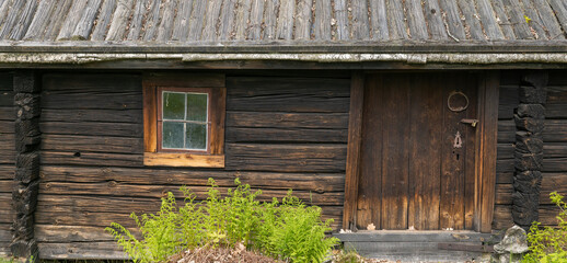 Fototapeta na wymiar Part of old wooden hut in north of Sweden.