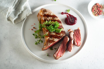 Grilled beef steak with herbs