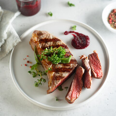 Grilled beef steak with herbs