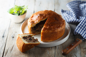 Traditional English meat pie with dried fruits
