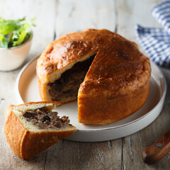 Traditional English meat pie with dried fruits