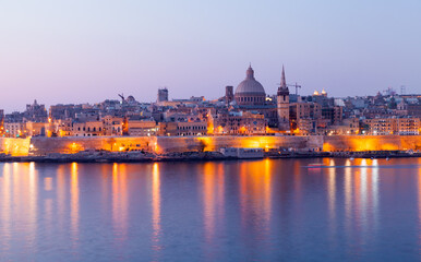 Fototapeta na wymiar Valletta old town panoramic night view, Malta. Coastal landscape