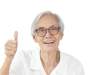 Fototapeta premium Happy asian old elderly wearing spectacles,raising hand sign,showing great thumbs up,smiling senior woman giving a thumbs up gesture,symbol of likes,good or success,isolated on white background