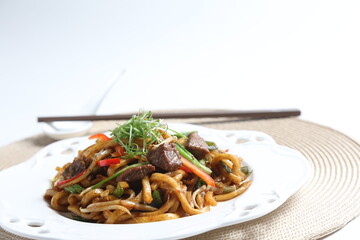 stir fried Japanese udon noodle mee in black pepper sauce with wagyu beef meat asian halal menu