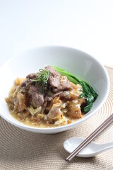 hot wok fried kway teow noodle with wagyu beef slices and vegetables in thick gravy egg sauce in bowl asian halal menu