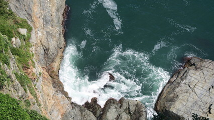 Aerial view of the cliff, the shore and the tidal wave in Taejongdae Park