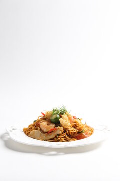 Stir Fried Spicy Chilli Noodle Mamak Mee Goreng With Mixed Seafood Fish, Prawn, Squid, Meat And Lime Asian Halal Menu