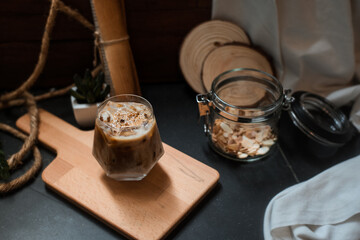 Obraz na płótnie Canvas cold brew coffee with milk on wooden table