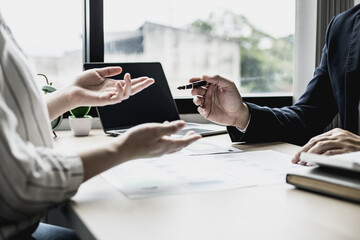 Meeting room atmosphere between the business partners who formed a startup company, they are having a brainstorming meeting together to plan the company's management. New business concept.