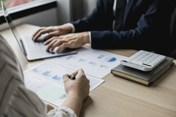 Two staff members of the finance department are sharing monthly financial statements together, they...