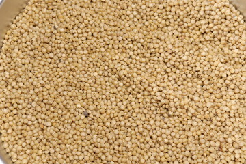 Organic jawar seeds isolated on wood background