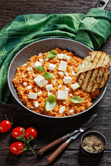 eggs scrambled with tomatoes and feta cheese