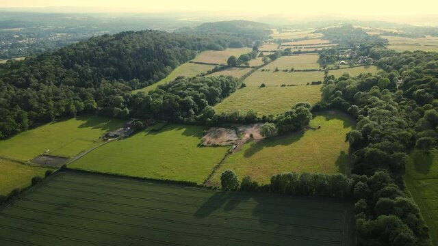 Aerial footage of the British country side fields in the winter time, Surrey country side, surrey hills. Guildford, UK.