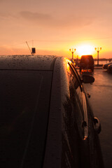 Rain drops on the car. Sunset after rain. Selective and soft focus