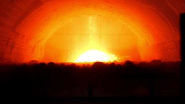 Roasting furnace. Industrial process of production of cement clinker or expanded clay. An industrial enterprise for the processing of cement. A red-hot furnace on the territory of a cement plant