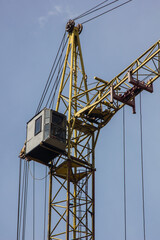 construction crane on sky background at construction site