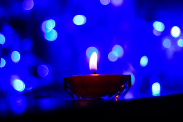 Candle lights in darkness with colorful light effects and bokeh for solemn moments and wallpaper....