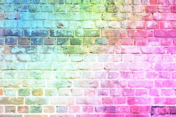 Fototapeta na wymiar A brick wall in the colors of the rainbow. Concept of LGBT support.
