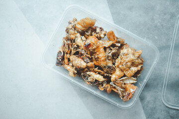Sweet and spicy squid in plastic box.