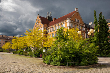 Fototapeta na wymiar Český Těšín Town Hall against a background of dramatic storm clouds