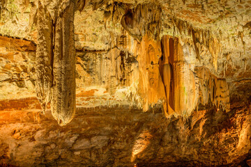 Cave from the Jurassic period with stalactites and stalagmites, located near the town of Molain in France. - 441721750